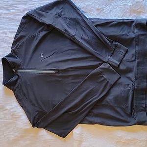 Travis Mathew quarter zip dark gray pullover. Size Large.